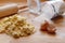 Baking with rolling pin, dough, sugar and empty egg shells on wood