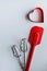 Baking supplies on white. Spatula, mixer whisks, cookie cutter on white background