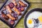 Baking tray with six baked pork and apple sausages