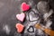 Baking for Valentines Day. Colorful Heart shapped cookies and kitchen utensils, top view