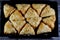 Baklava covered with piastachio and stuffed and soaked with honey sugar syrup, Eastern Turkish and Egyptian baklawa as a Ramadan