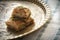 Baklava with pistachio on a golden tray with oriental patterns