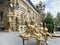 Baku, Azerbaijan, September, 10, 2019. Gilded sculptures in front of Taza Bey Hamam on Sheikh Shamil street, house 12. Woman with