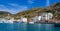 BALAKLAVA, UKRAINE - JUNE 27, 2012: View from the sea to the ruins of the fortress and modern buildings on the shore in Balaklava