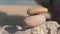 Balance pebbles stones stack tower against the sea.