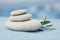 Balance pyramid of spa stones on natural blurred background.