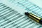 Balance sheet of a financial report with fountain pen