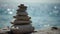 Balanced pebble pyramid on the beach on a sunny day. Abstract Sea bokeh on the background. Selective focus. Zen stones