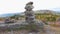 Balanced Rock Stones Stacked on Top of Each Other in the Mountain Valley. Hierarchy and Balance. Pyramid of Stones on