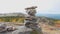 Balanced Rock Stones Stacked on Top of Each Other in the Mountain Valley. Hierarchy and Balance. Pyramid of Stones on