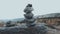 Balanced Rock Stones Stacked on Top of Each Other in the Mountain Valley. Hierarchy and Balance. Pyramid of Stones on