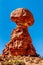 Balanced Rock, a tall and delicate sandstone Rock Formation in the desert landscape of Arches National Park