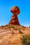 Balanced Rock, a tall and delicate sandstone Rock Formation in the desert landscape of Arches National Park