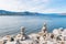 Balanced rocks on beach in the village of Naramata, with view of Okanagan Lake