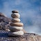 Balanced stone on a peddle beach during sunset.