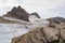 Balanced stone pyramid with Dirndl mountain