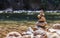 Balanced stone pyramide on shore On a stream of nature Blurred background bokeh