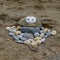 Balanced stones on the beach at Robin Hood`s Bay, UK