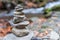 Balanced stones or stone pyramid on the river bank