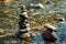Balanced stones Zen rock stack meditation art in flowing water of mountain stream