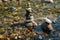 Balanced stones Zen rock stacks meditation art in flowing water of mountain stream