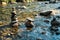 Balanced stones Zen rock stacks meditation art in flowing water of mountain stream