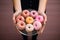 Balancing act Scales, donuts in womans hands, top view with copy space