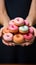 Balancing act Scales, donuts in womans hands, top view with copy space