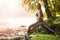 Balancing. Female practises balancing at nature tropical forest in a morning.