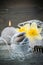 Balancing pebble stones and yellow flowers