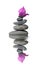 Balancing pebbles with purple bracts of bougainvillea