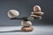Balancing pyramid of sea pebbles on a gray background, the concept of harmony and balance