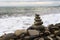 Balancing pyramid of sea stones on a pebble beach