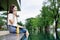 Balancing Relaxation and Connectivity, Woman on Vacation Checks Social Media by the Pool with Smartphone