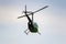 Balashikha, Moscow region, Russia - May 25, 2019: Helicopter Robinson R44 Raven RA-07368 flies against blue sky over airfield