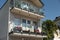 Balconies decorated with blooming potted flowers