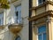 Balcony on classic european residential building. white wrought iron balustrade