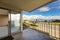 Balcony with door and water view.