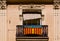 A balcony with a flag of the Valencian community