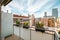 Balcony view of barcelona's urban architecture amidst a scenic residential district with a cloud-filled sky