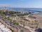 Balcony view over the Palm trees promenade and port with many boats in Larnaca town