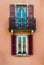 Balcony and windows with open shutters on classic apartment building