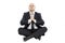 Bald adult man in a suit in the lotus position prays. Isolated on a white background