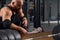 Bald athlete posing in garage