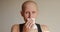 Bald cancer sick woman blowing running nose got flu cough cold, rhinitis sneezing in tissue or nosebleeds. Female is