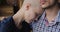 Bald desperate female cancer patient put head on husband shoulder