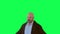 Bald English man acting and speaking from the opposite example on green screen