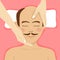 Bald-headed man having head massage in spa. Top view