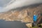 Bald male tourist taking pictures on his smart phone of amazing scenery. Stunning Slieve League Cliff in County Donegal, Ireland.