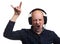 Bald man listening music with headphones. Isolated